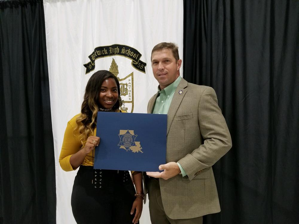 LSA Scholarship winner holding award