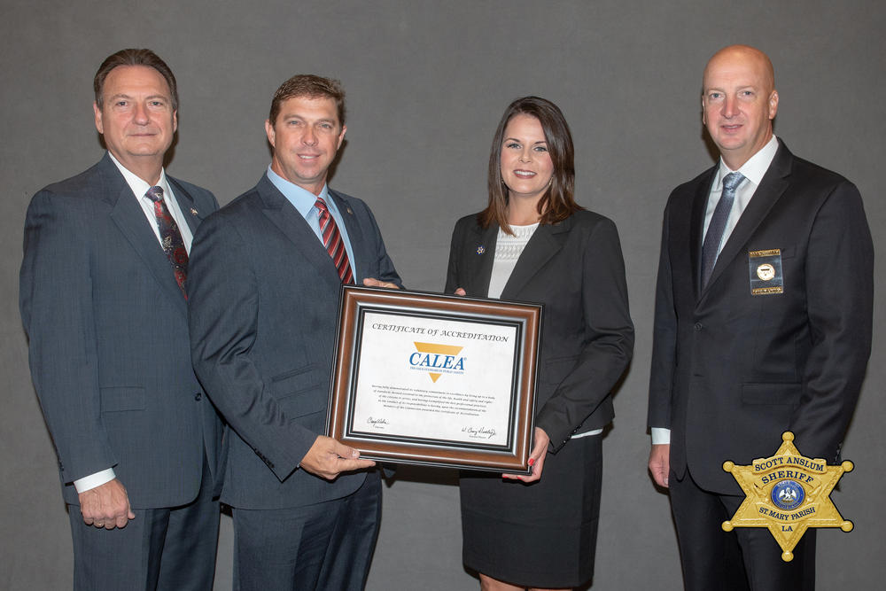 Chairman and Lafourche Parish Sheriff, Craig Webre, Sheriff Scott Anslum, Captain Stephanie Duhon, and Executive Director, W. Craig Hartley, Jr. accepting an award.