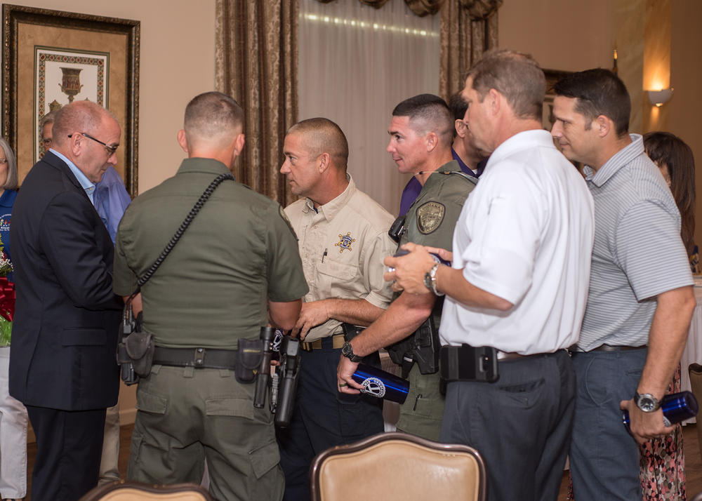 Another view of officers conversing.