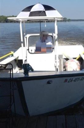 white boat with white and black awning cover