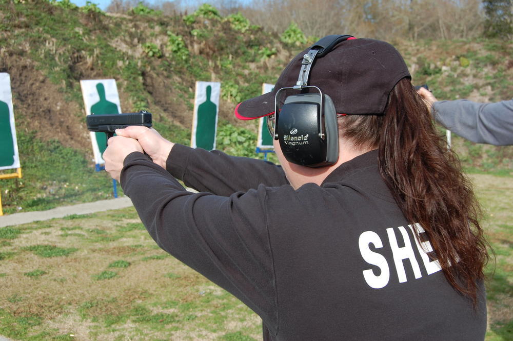 at gun range practicing pistol
