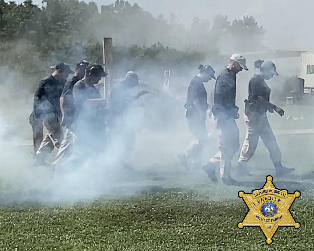 Training group walking through smoke