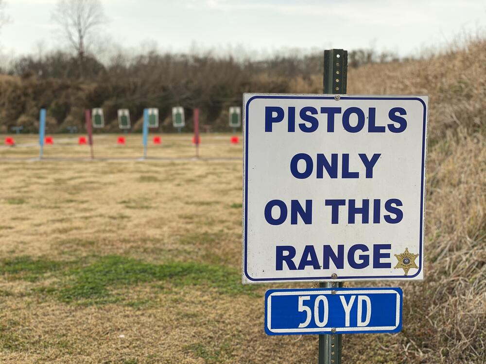 Pistols only on this range sign