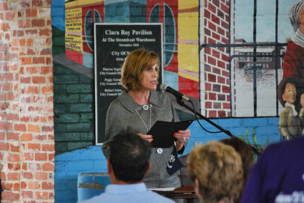 Woman speaking into microphone