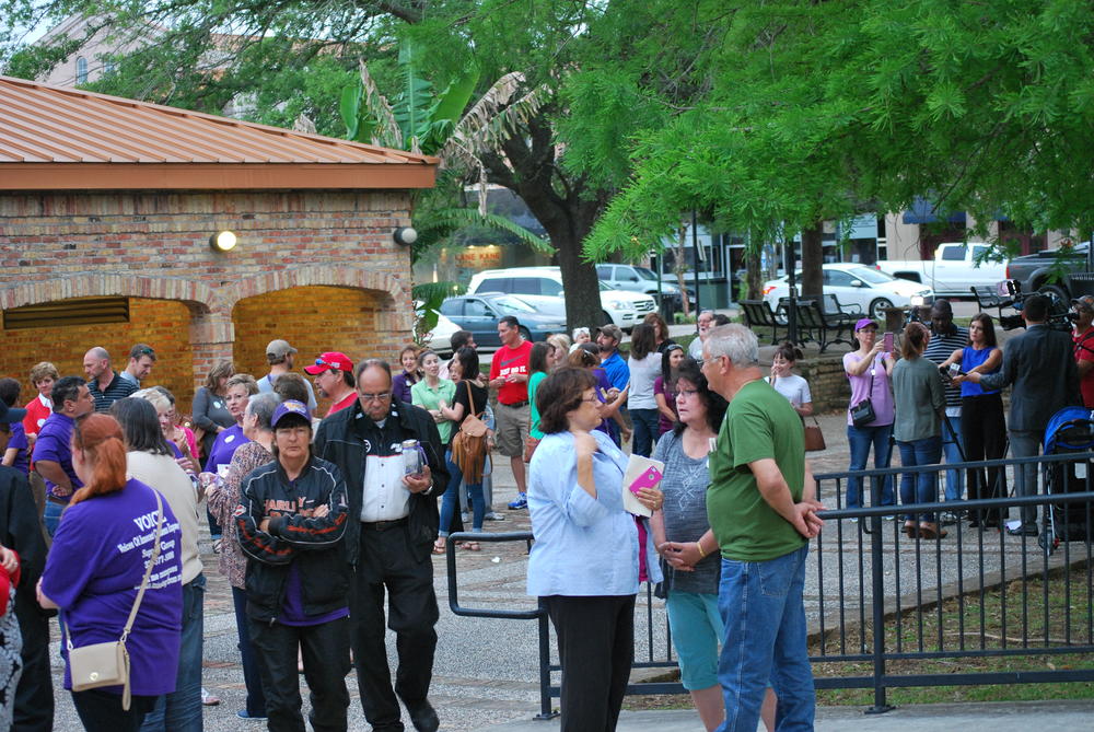 Large group of people standing outside together